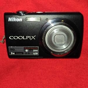Nikon Black Digital Camera with Compact Design and Zoom Lens